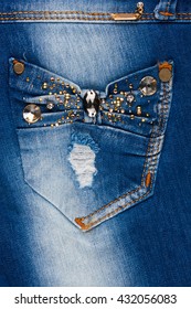 Jeans with pockets close-up decorated with rhinestones, may be used as background