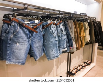 Jeans Shorts With ,khaki ,pants Hanging For Sale At Fashion Shop