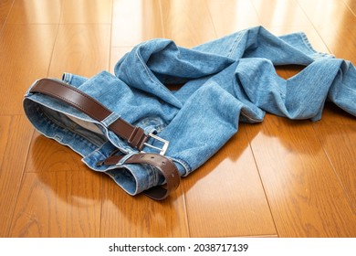 Jeans thrown off on the floor
