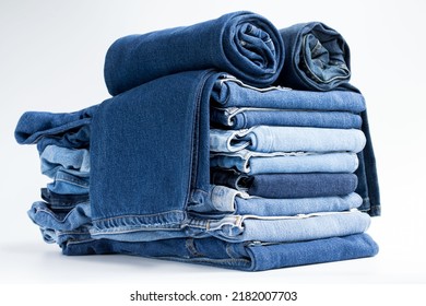 Jeans trousers stack on white background in supermarket and store. business jeans concept. - Shutterstock ID 2182007703