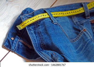 Jeans And Waist Meter. Overweight And Fashion