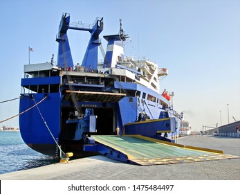 Jebel Ali, UAE, November 15, 2008. Unloading Heavy Equipment And Trucks From The Ro-Ro Vessel In The Port Of Jebel Ali