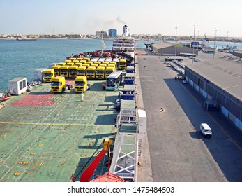 Jebel Ali, UAE, November 15, 2008. Unloading Heavy Equipment And Trucks From The Ro-Ro Vessel In The Port Of Jebel Ali