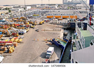 Jebel Ali, UAE, November 15, 2008. Unloading Heavy Equipment And Trucks From The Ro-Ro Vessel In The Port Of Jebel Ali