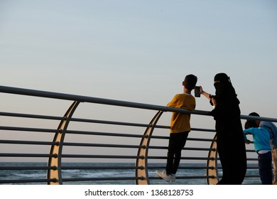 Jeddah, Saudi Arabia - December, 16 2018: Saudi Woman Taking A Selfie With Her Son At The Sea