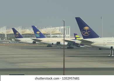 JEDDAH, SAUDI ARABIA – DECEMBER 22, 2018: Three SAUDIA Airplanes On The King Abdulaziz International Airport