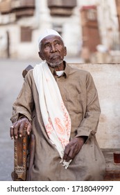 Jeddah / Saudi Arabia - January 16, 2020: portrait of famous traditional carpenter in Al-Balad drinking tea in the streets of downtown Jeddah
