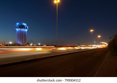 Jeddah Water Tower At Night, With Car Lights Motion On The Street. Saudi Arabia