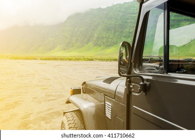 Jeep car on desert road.