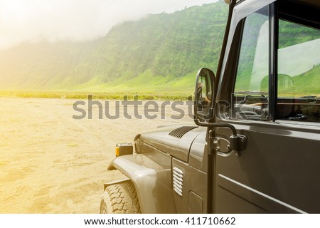 Jeep car on desert road.