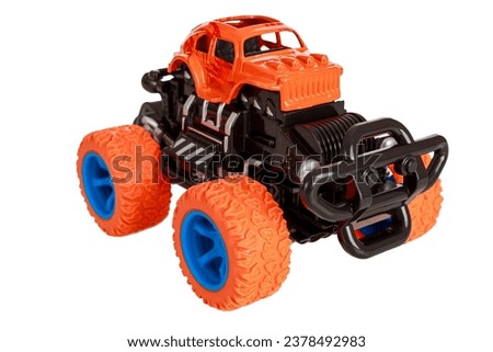Jeep car toy with big wheels, monster truck big foot children's toy, isolated on white background, close up
