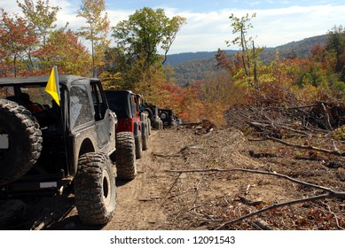 Jeep Jamboree Convoy Heading Down A Dirt Road.