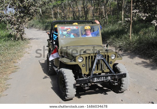 A jeep is used for Lava Tour Merapi adventure at di\
wisata lava tour gunung merapi trek basah dan kering Yogyakarta 20\
febuari 2018, jeep lava tour merapi siap disewa para turis wisata\
adventure 