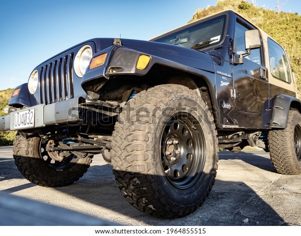 Jeep Wrangler Sport with large tires. Auckland, New\
Zealand - April 29, 2021