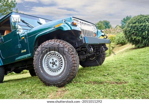 Jeep Wrangler SUV\
on a sloping surface of a lawn embankment in Schöningen, Germany,\
September 12, 2021