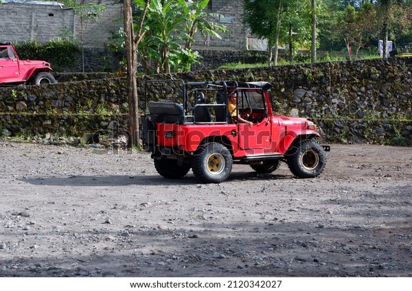 Jeep\'s in the yard.  di wisata jeep lava tour gunung\
merapi trek basah, wisata jeep adventure seru, rute basah melewati\
sungai or kali kuning,jeep,jeep, jipYogyakarta, Indonesia, February\
10, 2022