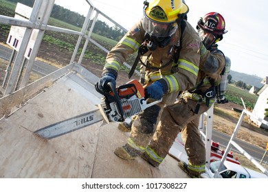 Jefferson, Oregon/USA - 09-22-12  Close Up Of Fire Fighter Using The Chain Saw