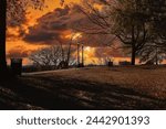 Jefferson Park, Richmond Virginia. Historic park with changing and falling leaves, piles of mulch, street  road signs, J. Fulmar Bright Monument, and views of City of Richmond, Va. 