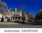 Jefferson Park, Richmond Virginia. Historic park with changing and falling leaves, piles of mulch, street  road signs, J. Fulmar Bright Monument, and views of City of Richmond, Va. 