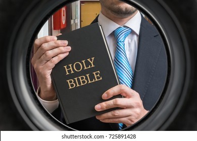 Jehovah Witness Is Showing Bible Behind Door. View From Peephole.