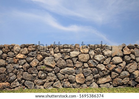 Jeju Island traditional thatched house stone wall - Korea