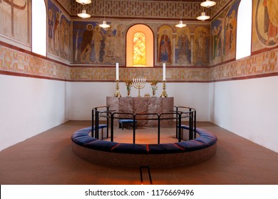 Jelling, Denmark. September 10. 2018. Altar, Kneeler And Murals In Jelling Church. Archeologist Have Found Bones Buried Under The Church Floor, Presumably Those Of Viking King Gorm The Old.