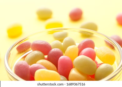 Jelly Beans Spill From Open Glass Bottles And Metal Fasteners II
Colorful Mixed Fruity Jelly Beans On Background