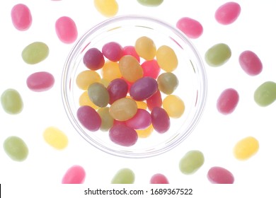 Jelly Beans Spill From Open Glass Bottles And Metal Fasteners II
Colorful Mixed Fruity Jelly Beans On Background