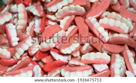Jelly teeth sweets. Teeth candy. Halloween gummy milk teeth or sweet jelly candies. Vampire teeth gummy. High quality photo