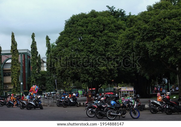 Jember, East Java - April 11, 2021: Portrait of\
local residents arriving to feel the sensation of jogging in the\
town square area of\
Jember