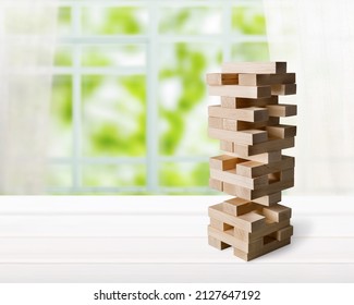 Jenga Tower Made Of Wooden Blocks Falling On Thee Background