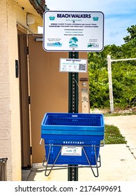 JENSEN BEACH, FL, USA - JULY 1, 2022: People Can Borrow Baskets Provided By St. Lucie County To Collect Debris And Help Keep The Beach Clean At Dollman Park Beachside Along The Atlantic Coastline.