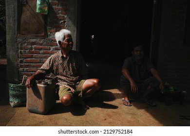 Jepara, Indonesia, February 28, 2022, An Old Man Sunbathing In The Morning To Maintain His Immune System