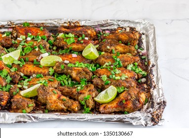 Jerk Chicken Wings On A BAking Sheet Horizontal Photo. Jamaican Style Chicken Wings With Lemon And Ciilantro.