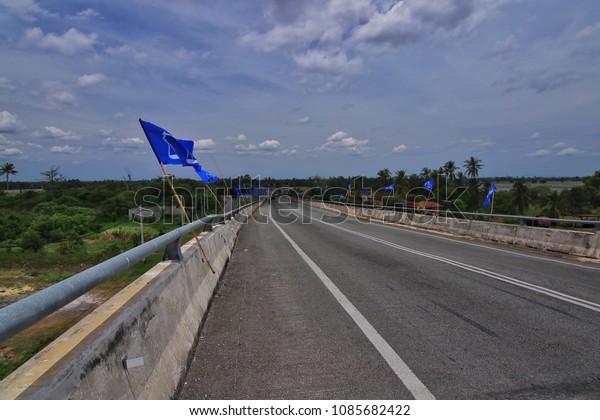 Jerlun, Kedah-April\
14th,2018:A lot of political party flag were install along the road\
nearby Kodiang KTM flyover. Malaysia 14th General Election will be\
held on 9th May 2018