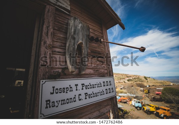 Jerome, Arizona / USA - April 14, 2019: The Gold\
King Mine and Ghost Town is home to dilapidated buildings, an old\
mine and a large collection of old cars. An abandoned dentist\'s\
office is visible.