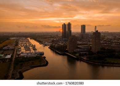 Jersey City With Morris Canal Park At Sunset. 