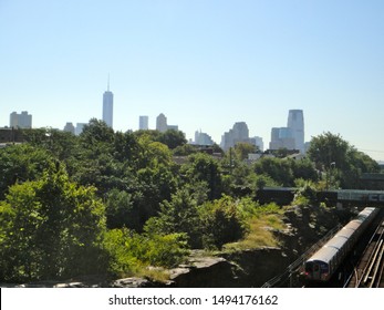 Jersey City, NJ - September 1 2013: View Of A PATH Train Departing The Journal Square Station And The New York City Skyline In The Background