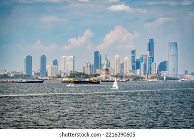 Jersey City, NJ. USA - August 20, 2022: Skyline Of Jersey City With The Statue Of Liberty From The Staten Island Ferry