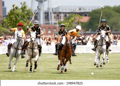 JERSEY CITY, NJ-MAY 31: Marcos Garcia del Rio (C) in action during the polo match at the 7th Annual Veuve Cliquot Polo Classic at Liberty State Park on May 31, 2014 in Jersey City, NJ.
