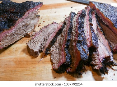 Jersey City, NJ/USA - March 2018: Sliced smoked brisket on the cutting board. 