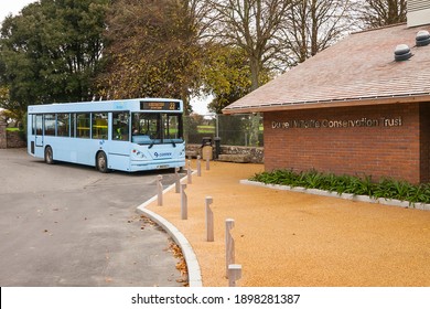 Jersey, UK - November 05, 2011: The Blue Bus Stops At Durrell Wildlife Conservation Trust Red Brick Entrance