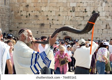 JERUSALEM - APRIL 05: The Jewish Pesach (Passover) Celebration At The Wailing Wall On April 05 2007. An Orthodox Religious Jew Wearing A Prayer Shawl Draped Blow The Shofar (horn).