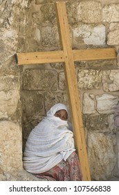 JERUSALEM - APRIL 13 : Ethiopian Christian pilgrim sit with across at the church of the Holy sepulchre in Jerusalem israel during Good Friday on April 13 2012