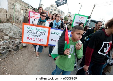 JERUSALEM - DECEMBER 3: unidentified Activists stage a demonstration in the Sheikh Jarrah neighborhood of East Jerusalem on Dec. 3, 2010 to protest the takeover of Palestinian houses by Jewish settlers.