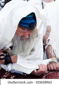 JERUSALEM, ISRAEL - APRIL 26: An unidentified Jewish man praying at the western wall on a jewish holiday Israel's 64th Independence Day on April 26, 2012 in Jerusalem, Israel