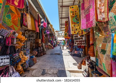 JERUSALEM, ISRAEL - AUGUST 21, 2013: Bazaar in Old City offer middle east traditional products, souvenirs and religious icons. It is very popular with tourists and pilgrims visiting Jerusalem, Israel.