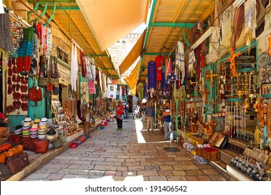 JERUSALEM, ISRAEL - AUGUST 21, 2013: Bazaar in Old City of Jerusalem with variety of middle east traditional products and souvenirs. It is very popular with tourists and pilgrims visiting Holy Land.