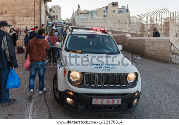 Jerusalem, Israel, December 28, 2018 :\
Palestinian traffic police car stands near to the Church of\
Nativity in Bethlehem in\
Palestine