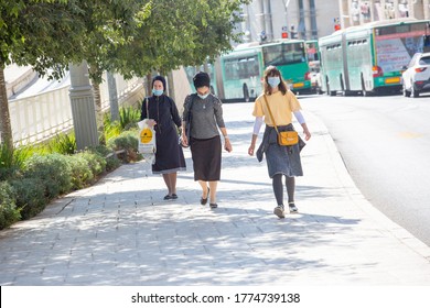 JERUSALEM, ISRAEL- JULE 12, 2020: Coronavirus Soars Among Ultra-Orthodox Jews. Religious Jewish women wearing protective masks walk around a Central Bus Station.